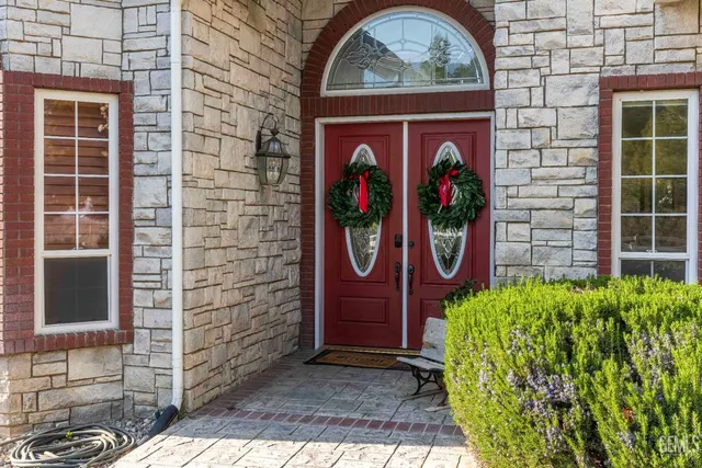a backyard of a house with table and chairs