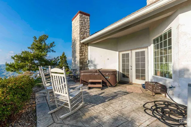 a view of a swimming pool with a patio