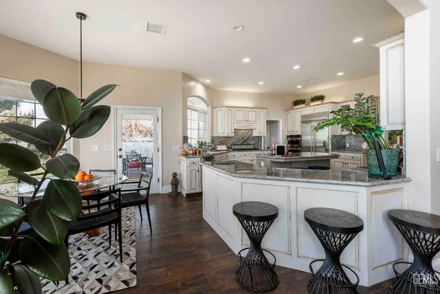 a view of a livingroom with workspace and a window