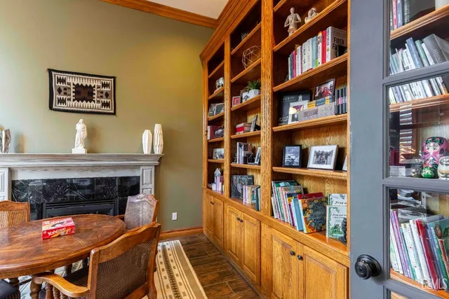 a bathroom with a granite countertop sink a toilet a mirror and shower