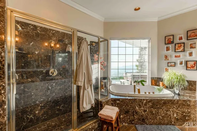 a bathroom with a sink a toilet and shower a mirror