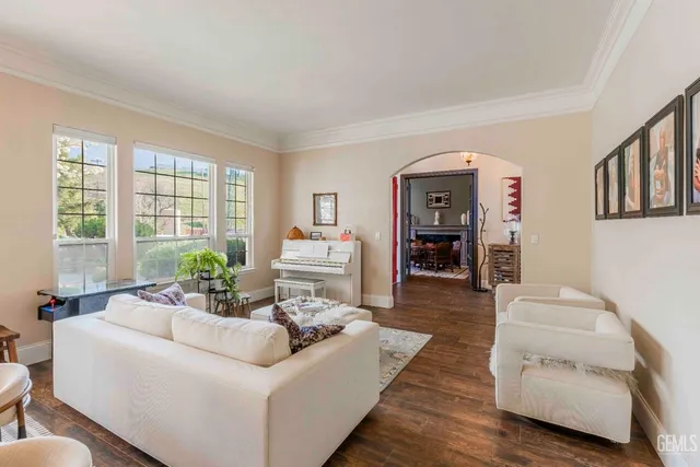 a living room with furniture a window and a table