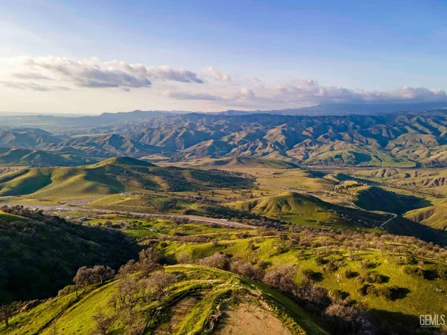 a bedroom with furniture and a large window