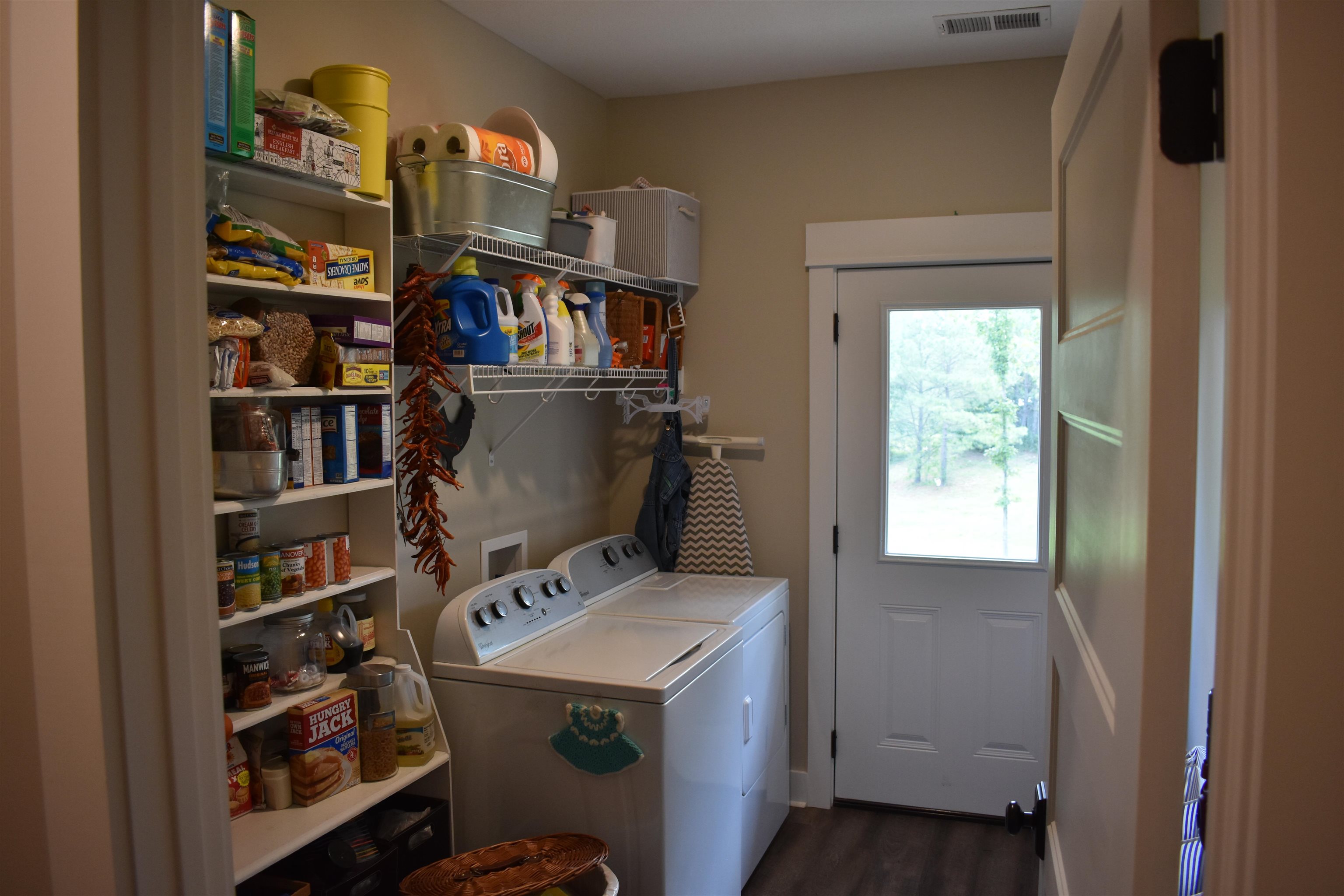 3895 Enville Road Henderson, TN 38340 - Photo 13 of 25 a view of storage and utility room with washer and dryer
