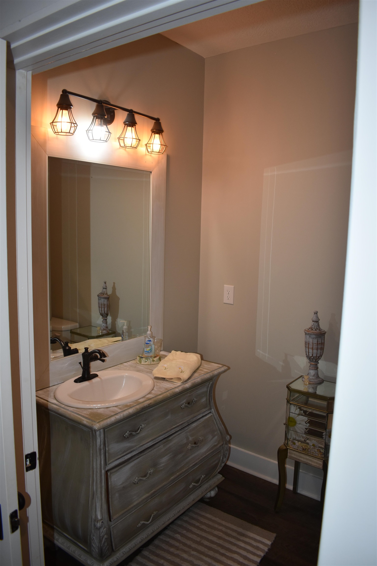3895 Enville Road Henderson, TN 38340 - Photo 16 of 25 a bathroom with a sink and a mirror