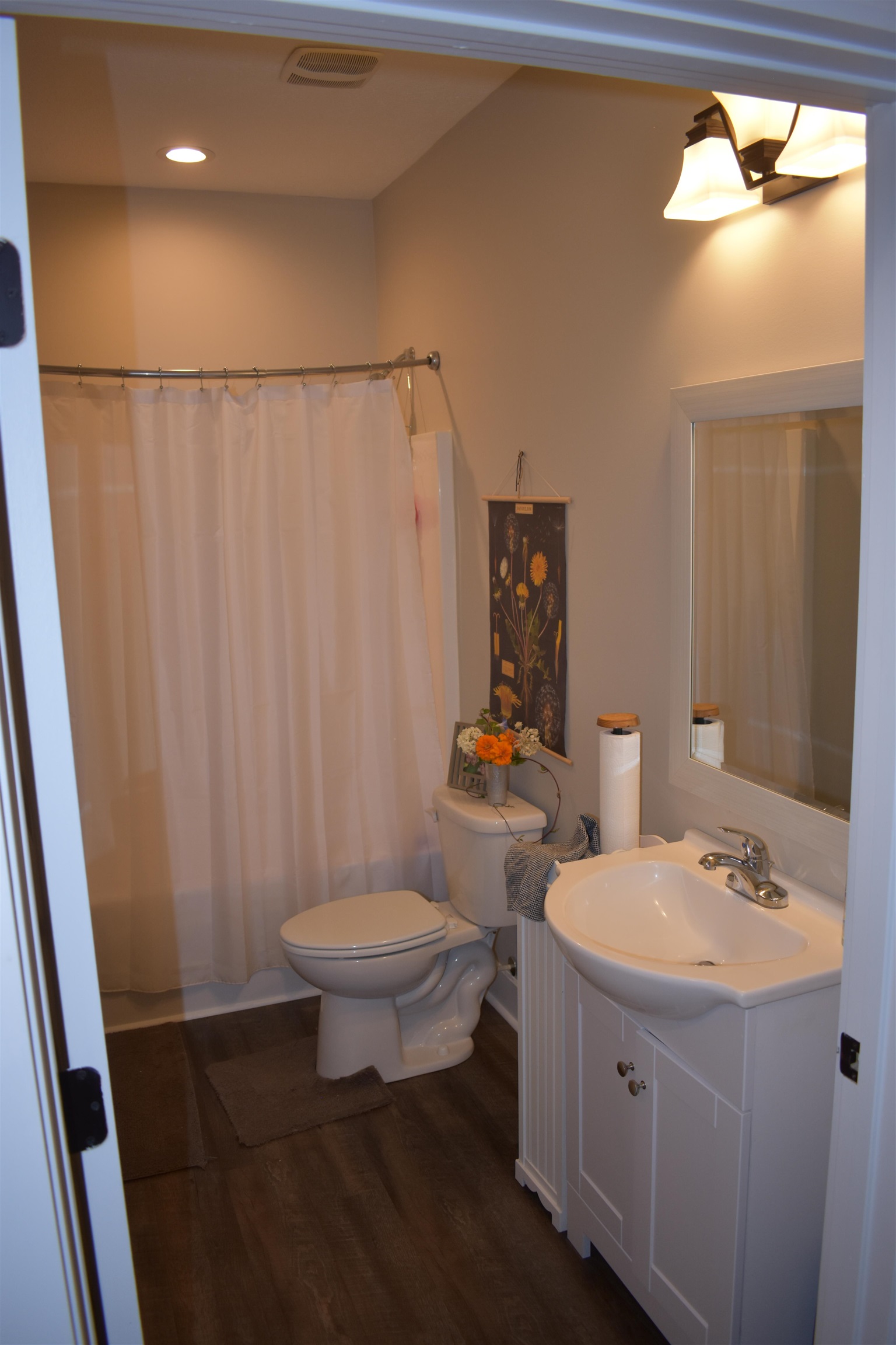 3895 Enville Road Henderson, TN 38340 - Photo 19 of 25 a bathroom with a sink toilet and shower