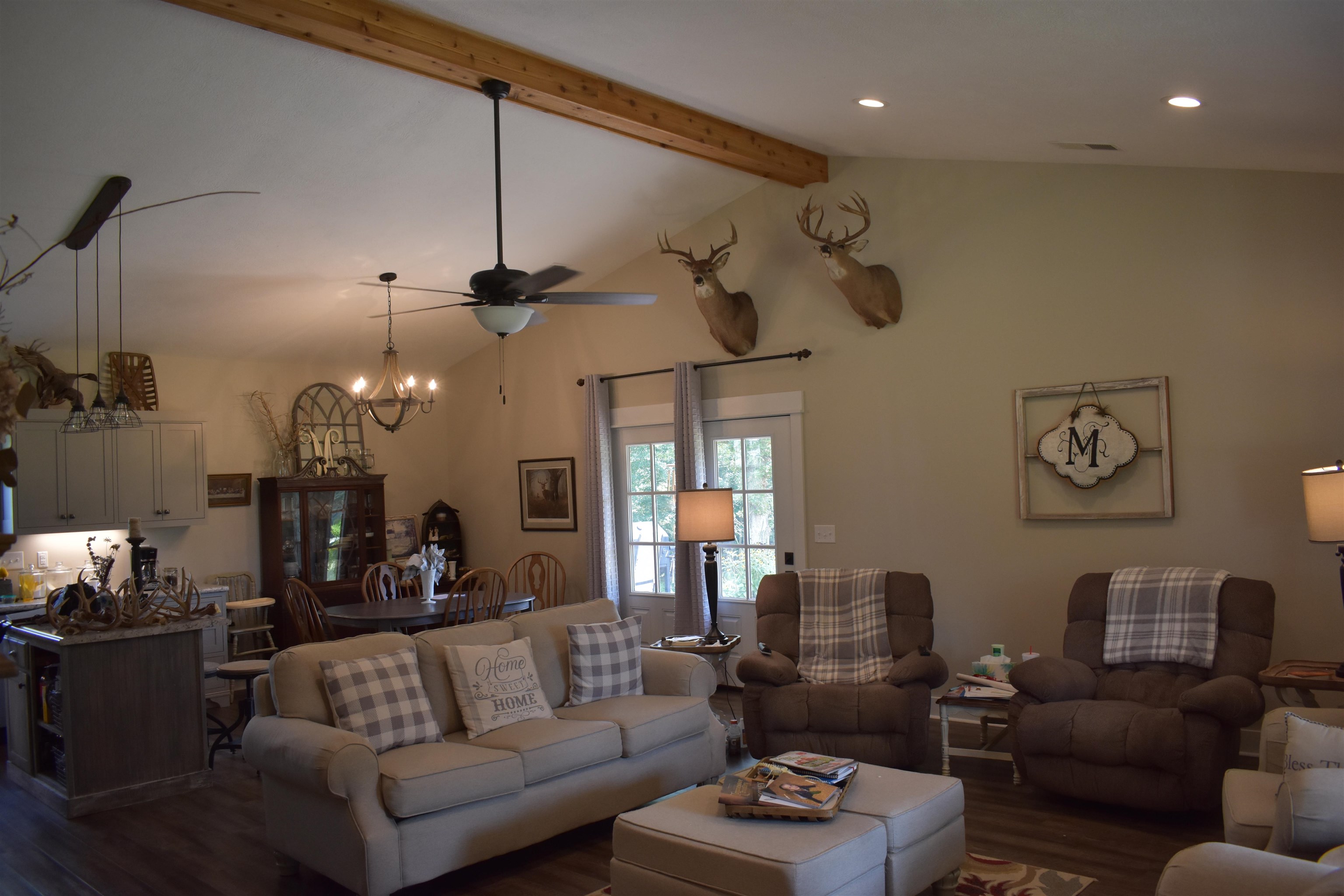 3895 Enville Road Henderson, TN 38340 - Photo 10 of 25 a living room with furniture kitchen view and a chandelier