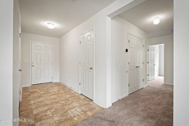 a view of entryway with white walls