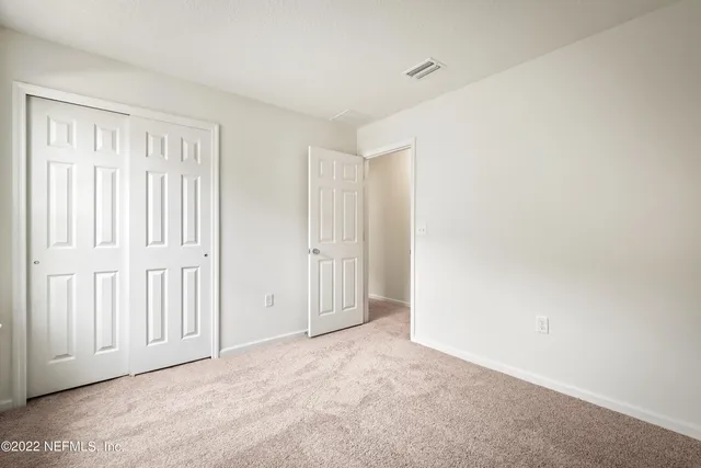 a bathroom with a sink a toilet a mirror and vanity