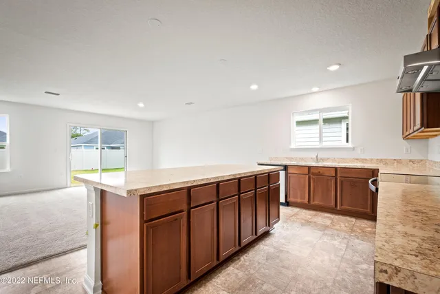 a kitchen with wooden cabinets and sink