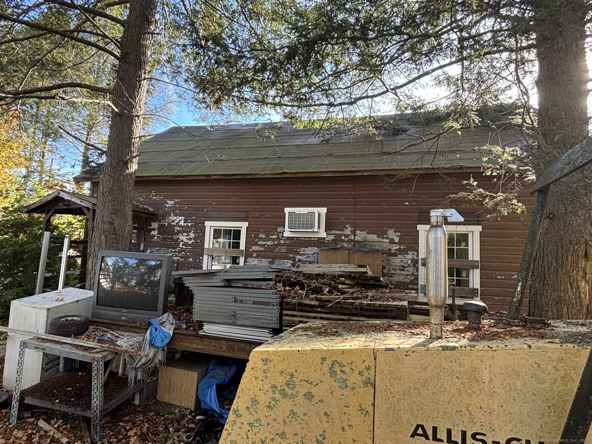 1405 New Haven Road Naugatuck, CT 06770 - Photo 15 of 27 a view of a patio with table and chairs with wooden floor and fence