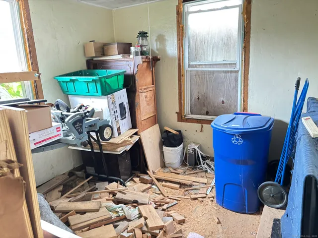 a room with furniture and a window