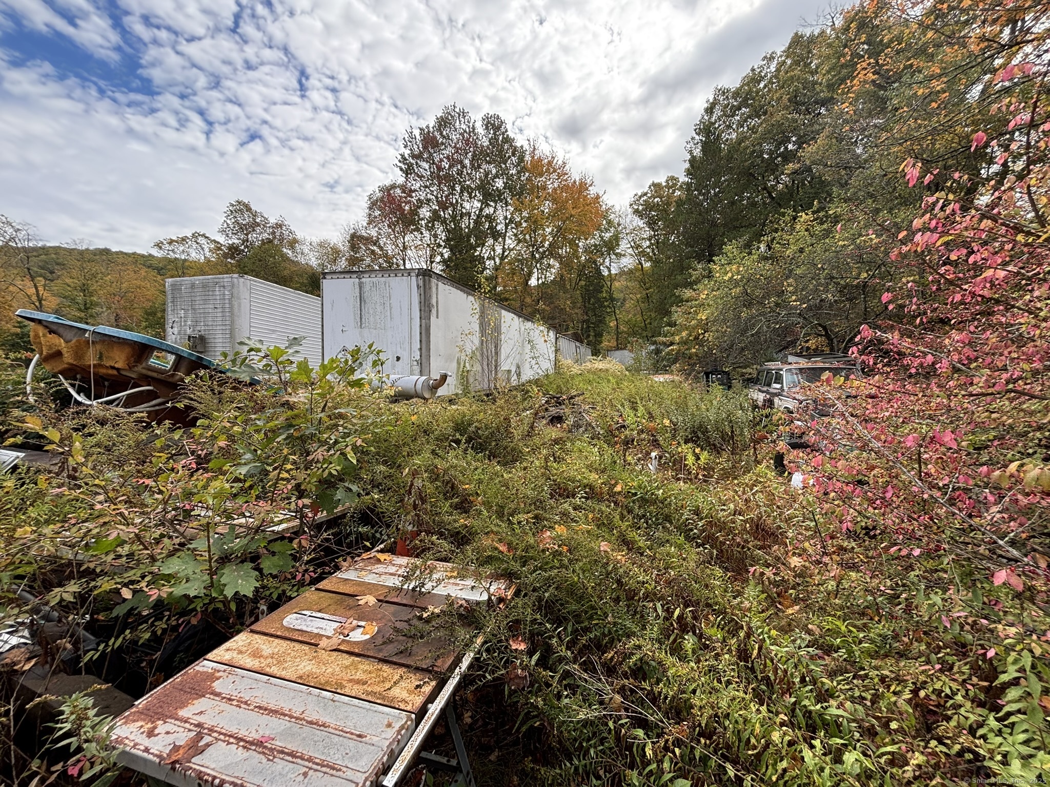 1405 New Haven Road Naugatuck, CT 06770 - Photo 2 of 27 a backyard of a house with lots of green space