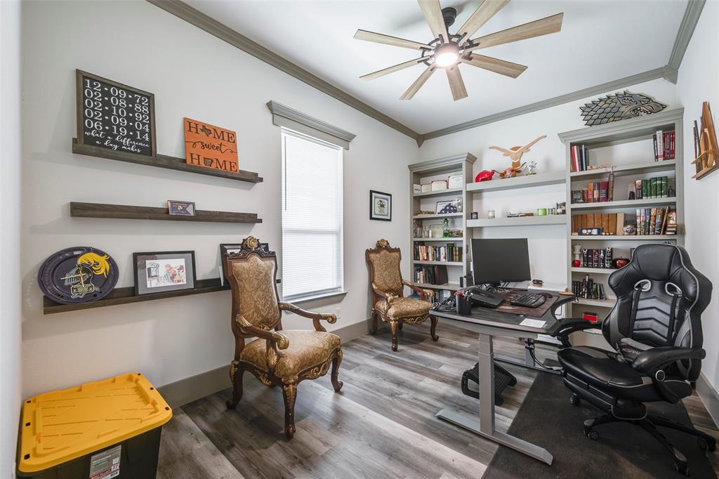 705 Old Agnes Road Weatherford, TX 76088 - Photo 11 of 32 a work room with furniture and wooden floor