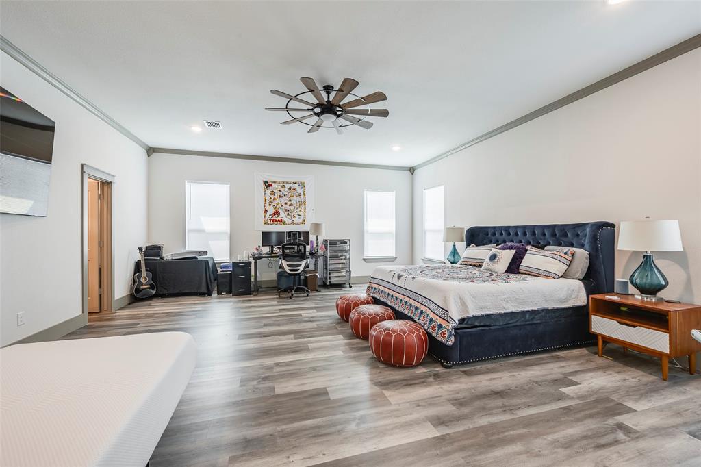 705 Old Agnes Road Weatherford, TX 76088 - Photo 13 of 32 a spacious bedroom with a bed and couch
