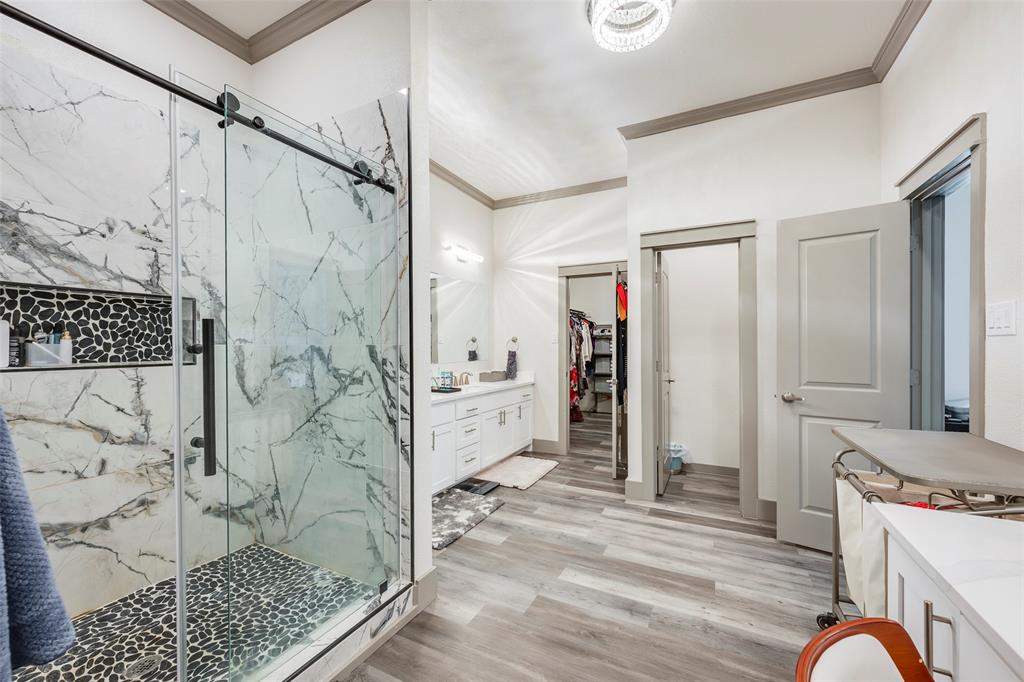 705 Old Agnes Road Weatherford, TX 76088 - Photo 15 of 32 a bathroom with a granite countertop shower a sink and a mirror