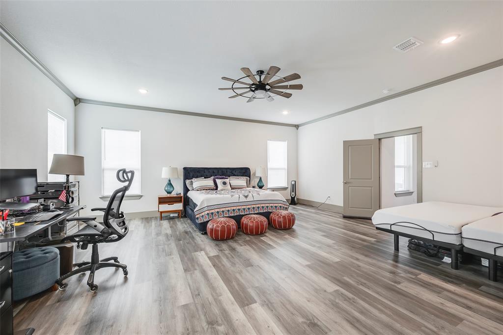 705 Old Agnes Road Weatherford, TX 76088 - Photo 18 of 32 a bedroom with furniture and a wooden floor