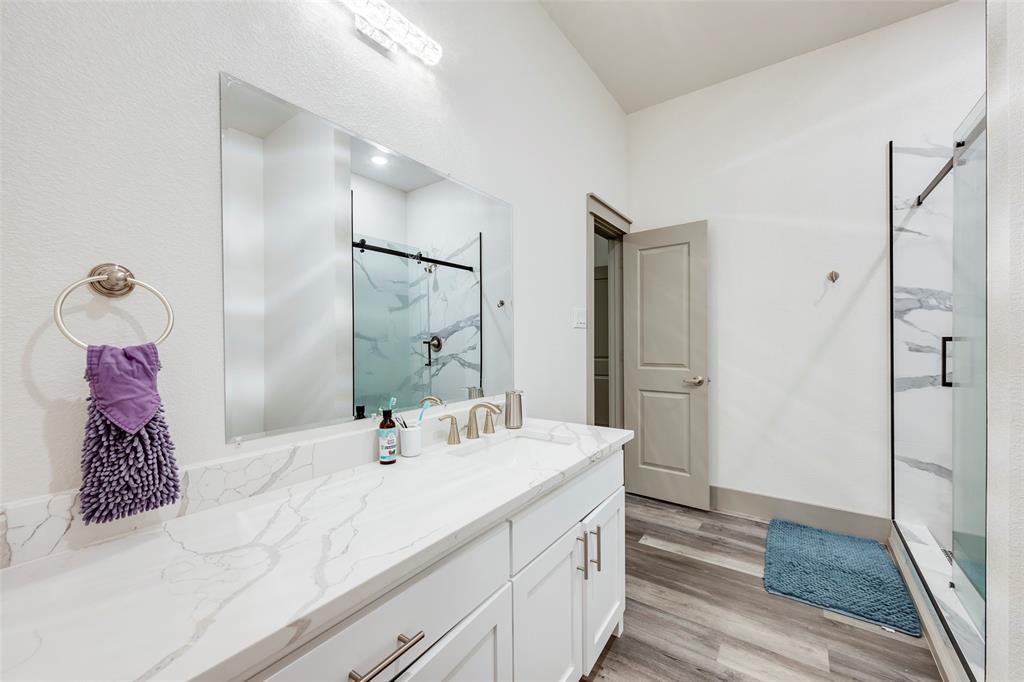 705 Old Agnes Road Weatherford, TX 76088 - Photo 19 of 32 a bathroom with a sink and a mirror