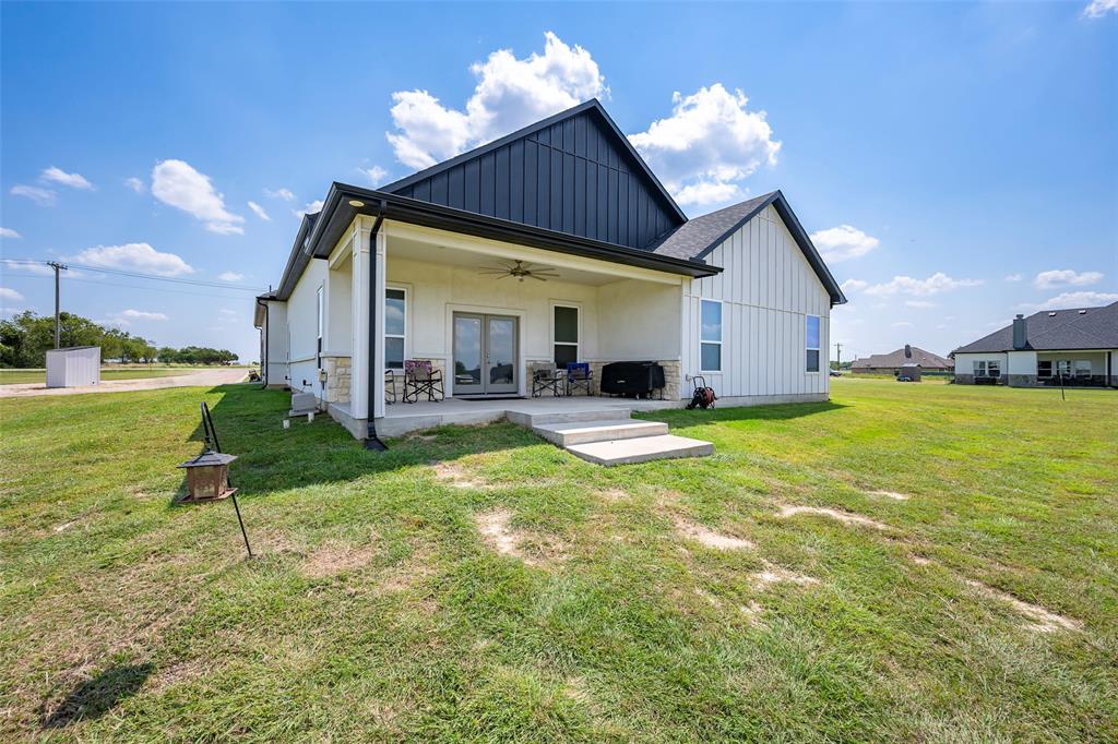 705 Old Agnes Road Weatherford, TX 76088 - Photo 30 of 32 a view of a house with a yard patio and swimming pool