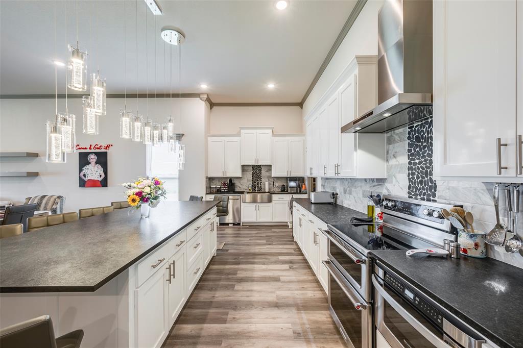 705 Old Agnes Road Weatherford, TX 76088 - Photo 4 of 32 a large kitchen with stainless steel appliances lots of counter space and a sink