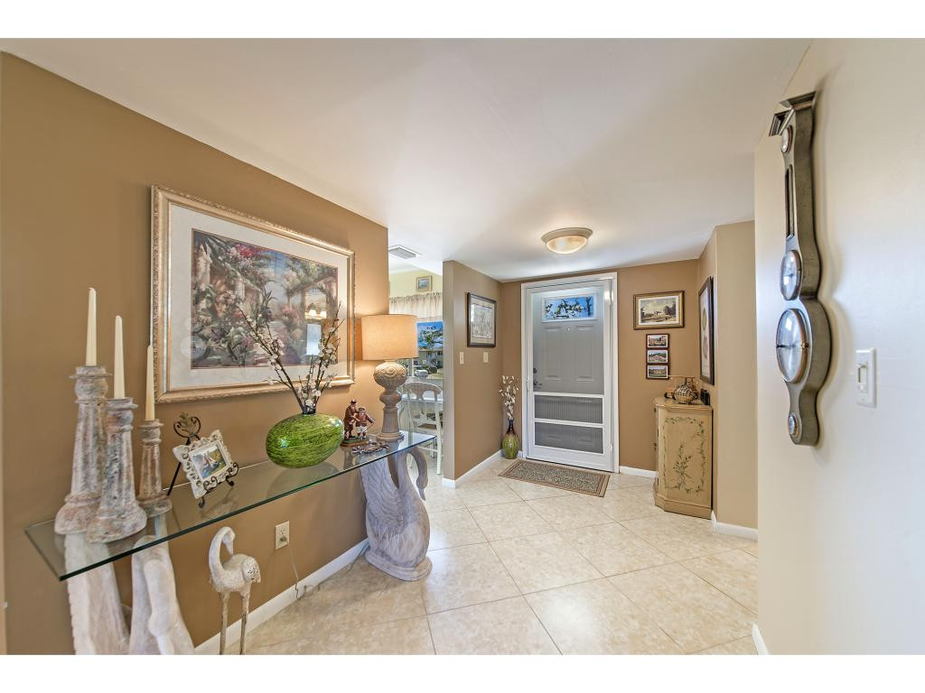 740 Teryl Road, Unit 2074 Naples, FL 34112 - Photo 12 of 18 a living room with furniture and a window