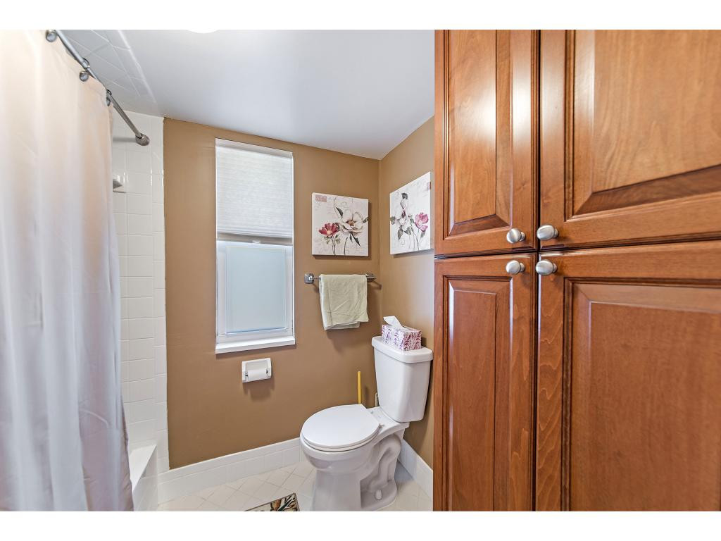 740 Teryl Road, Unit 2074 Naples, FL 34112 - Photo 15 of 18 a bathroom with a toilet a sink and mirror