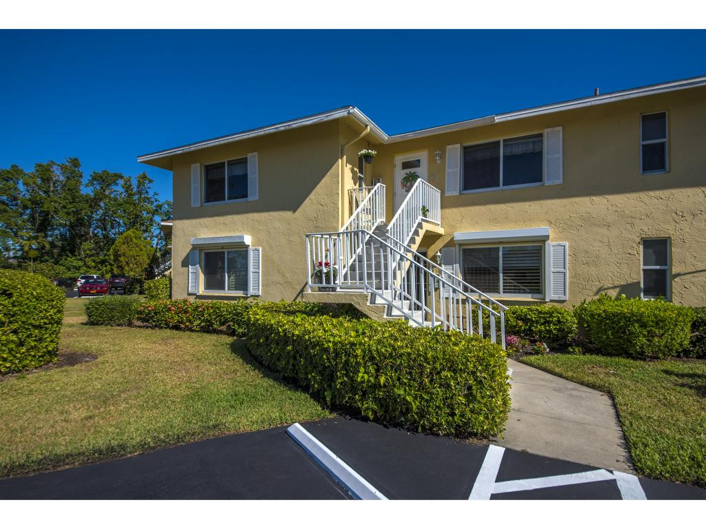 740 Teryl Road, Unit 2074 Naples, FL 34112 - Photo 18 of 18 a front view of a house with a yard