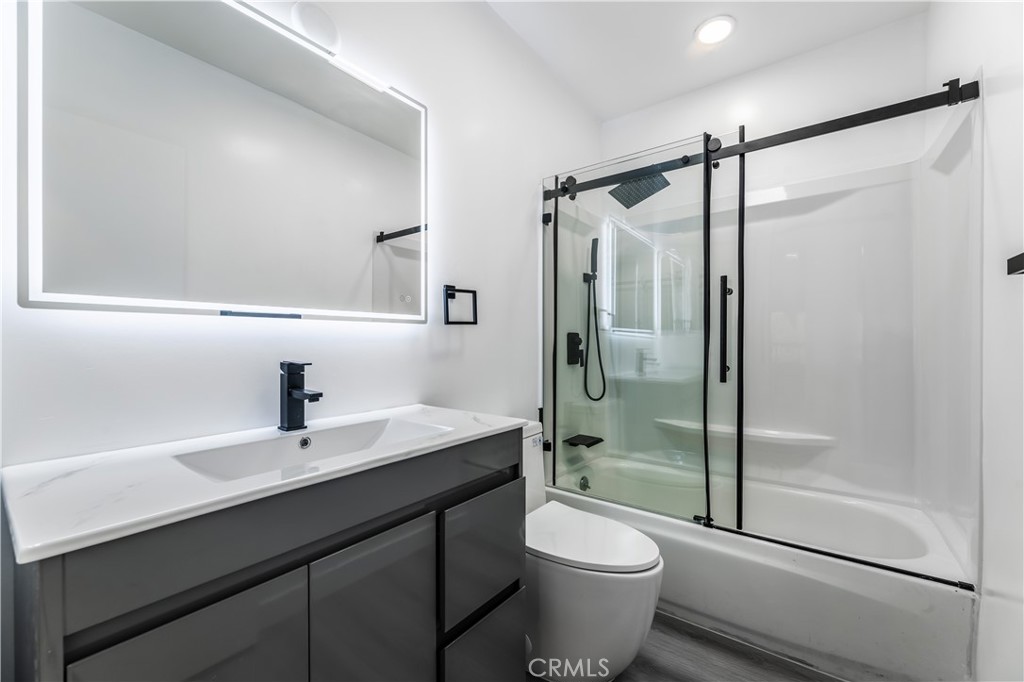7953 Vía Latina Burbank, CA 91504 - Photo 12 of 30 a bathroom with a sink a toilet and shower