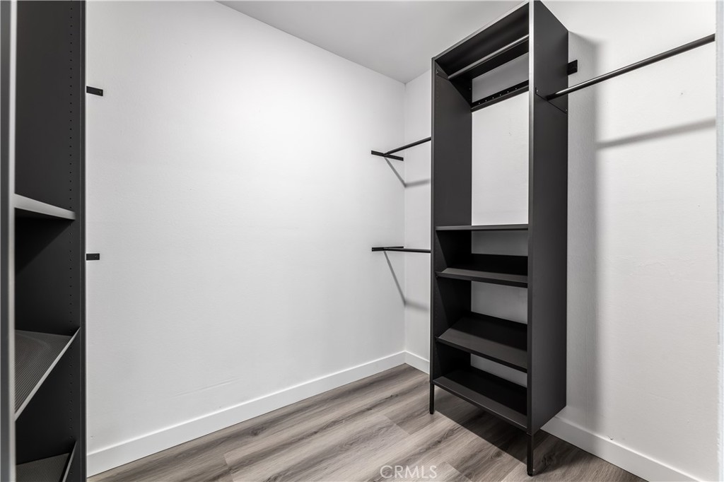 7953 Vía Latina Burbank, CA 91504 - Photo 13 of 30 a view of walk in closet with empty racks