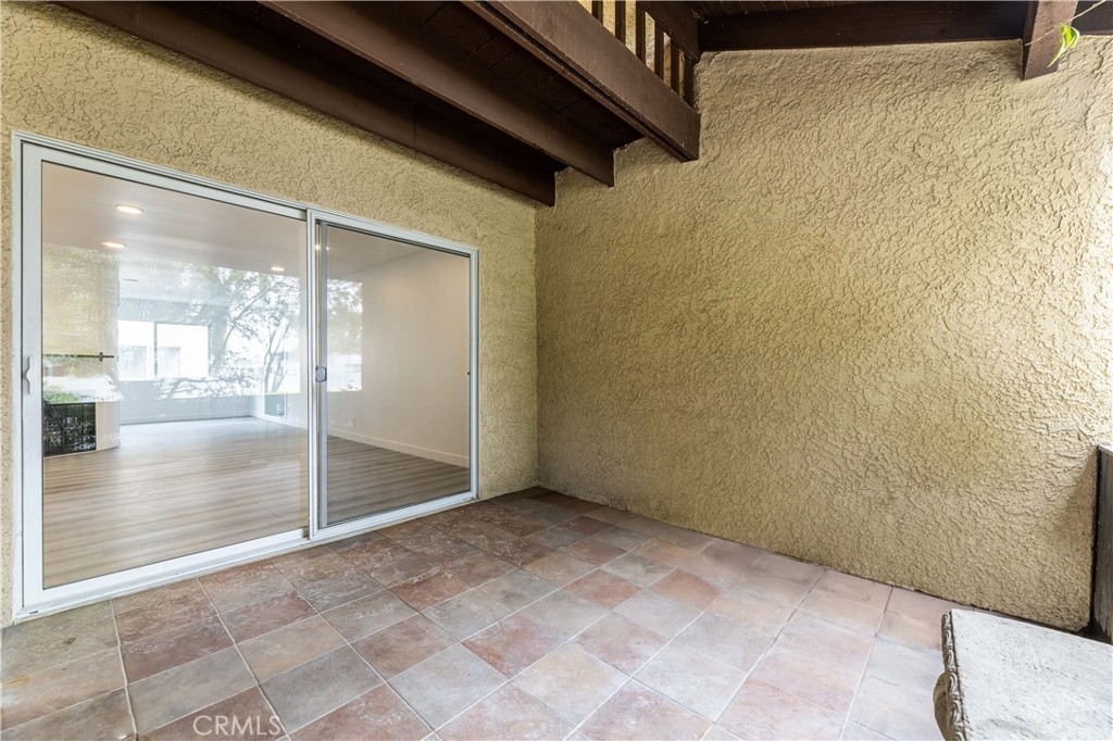 7953 Vía Latina Burbank, CA 91504 - Photo 25 of 30 a view of a hallway with a glass door