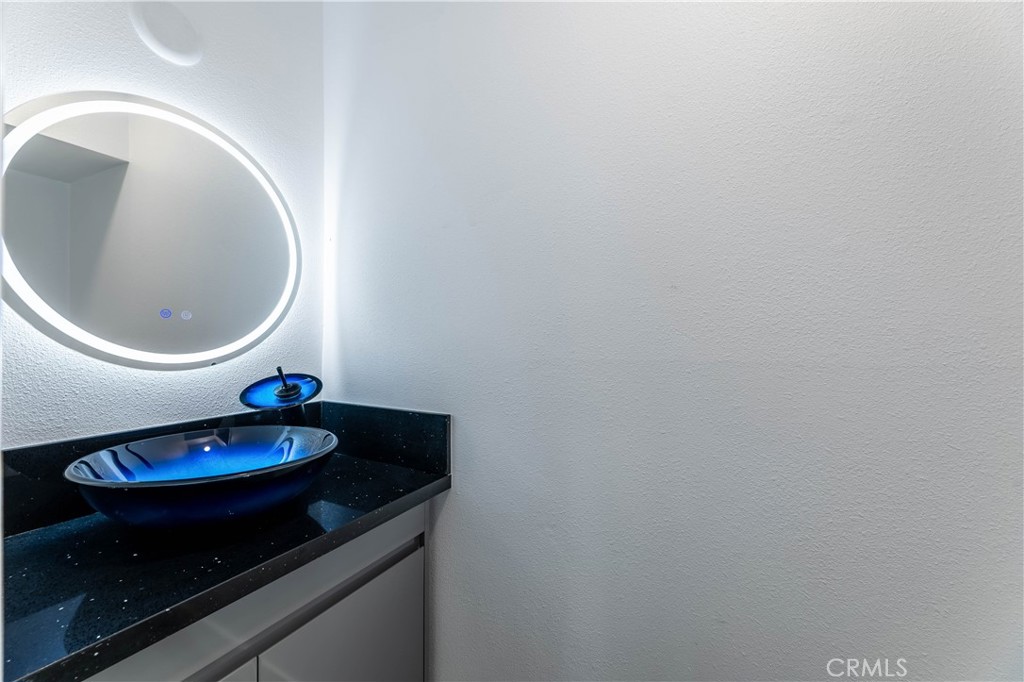 7953 Vía Latina Burbank, CA 91504 - Photo 4 of 30 a bathroom with a toilet and a sink