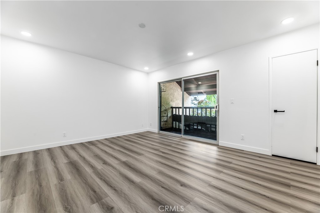 7953 Vía Latina Burbank, CA 91504 - Photo 9 of 30 wooden floor in an empty room with a window
