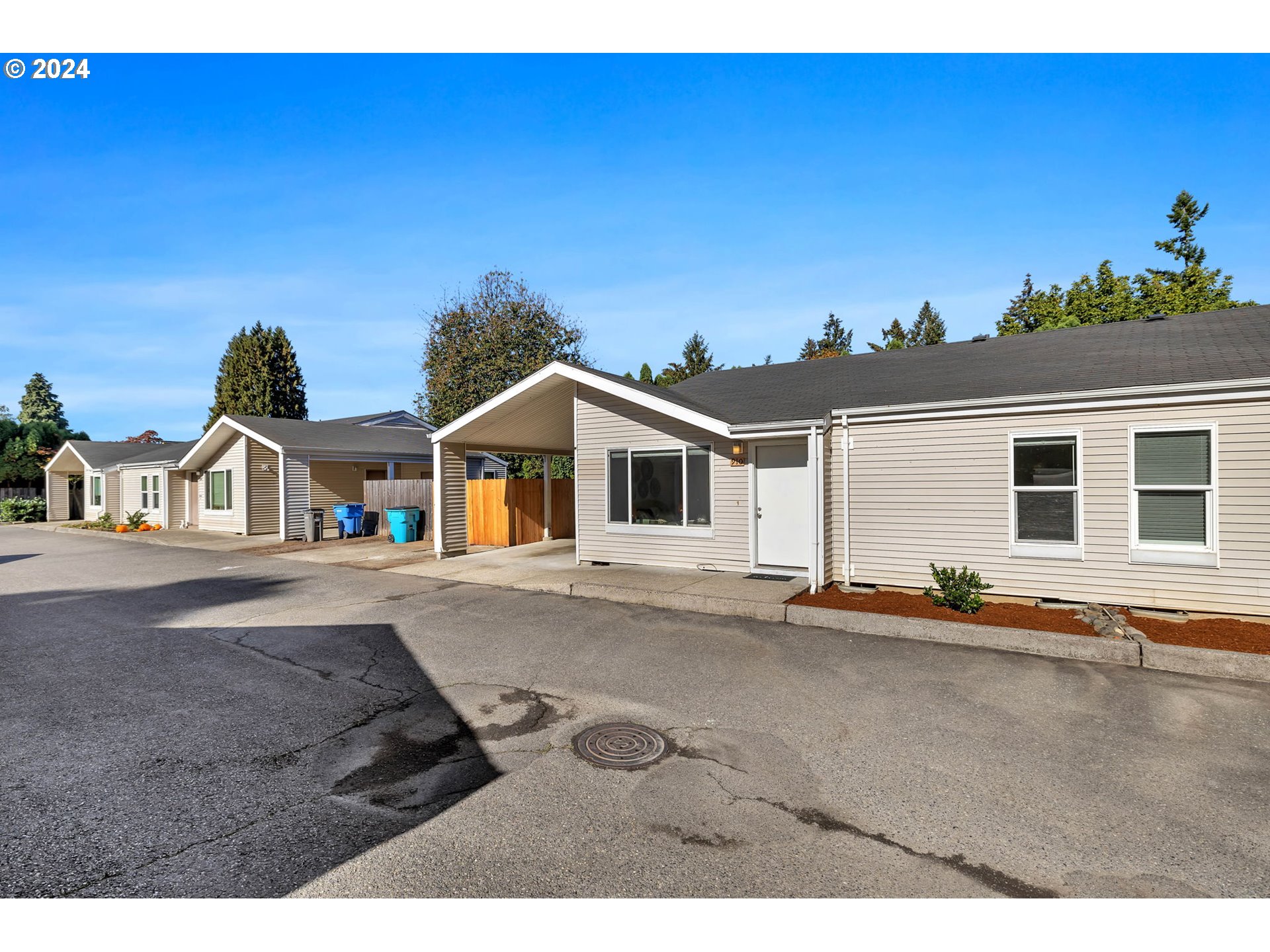 902 Pioneer Street, Unit 910 Ridgefield, WA 98642 - Photo 31 of 31 a front view of a house with a road