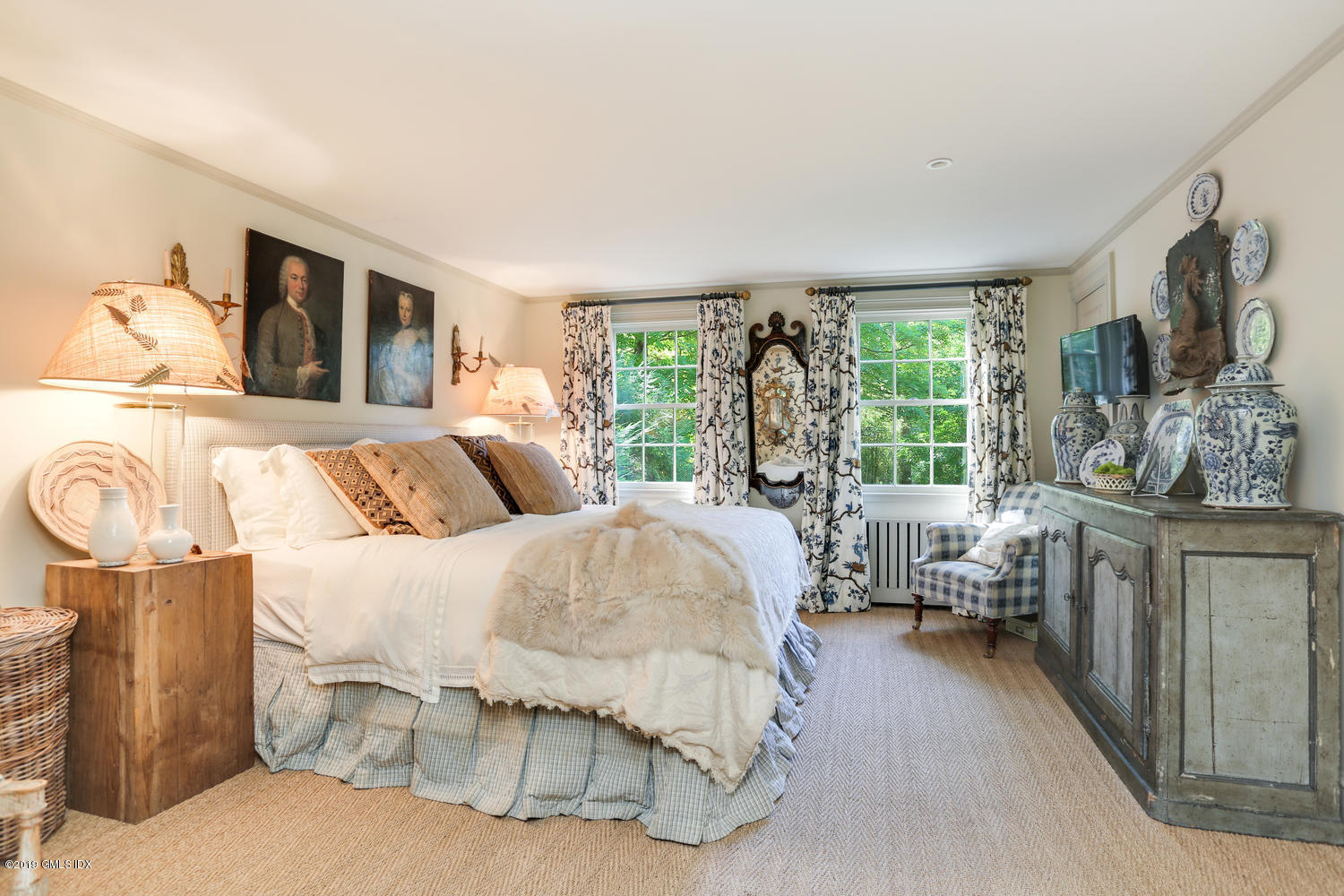 166 Old Church Road Greenwich, CT 06830 - Photo 11 of 20 a bedroom with a large bed and a couch