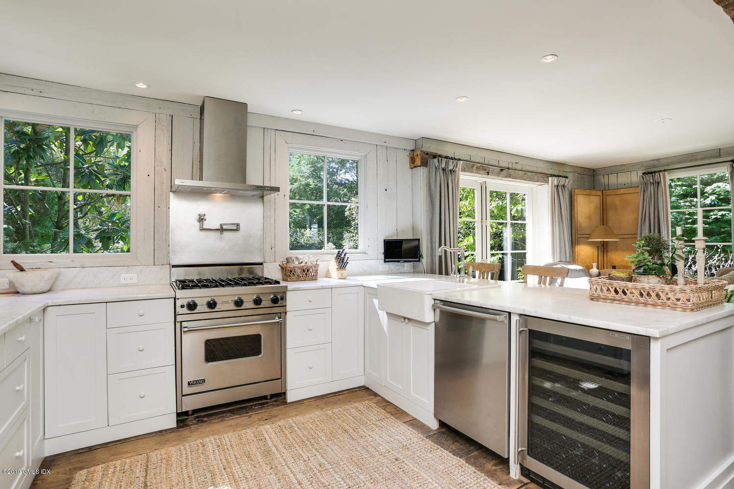 166 Old Church Road Greenwich, CT 06830 - Photo 7 of 20 a kitchen with a stove a sink and a window