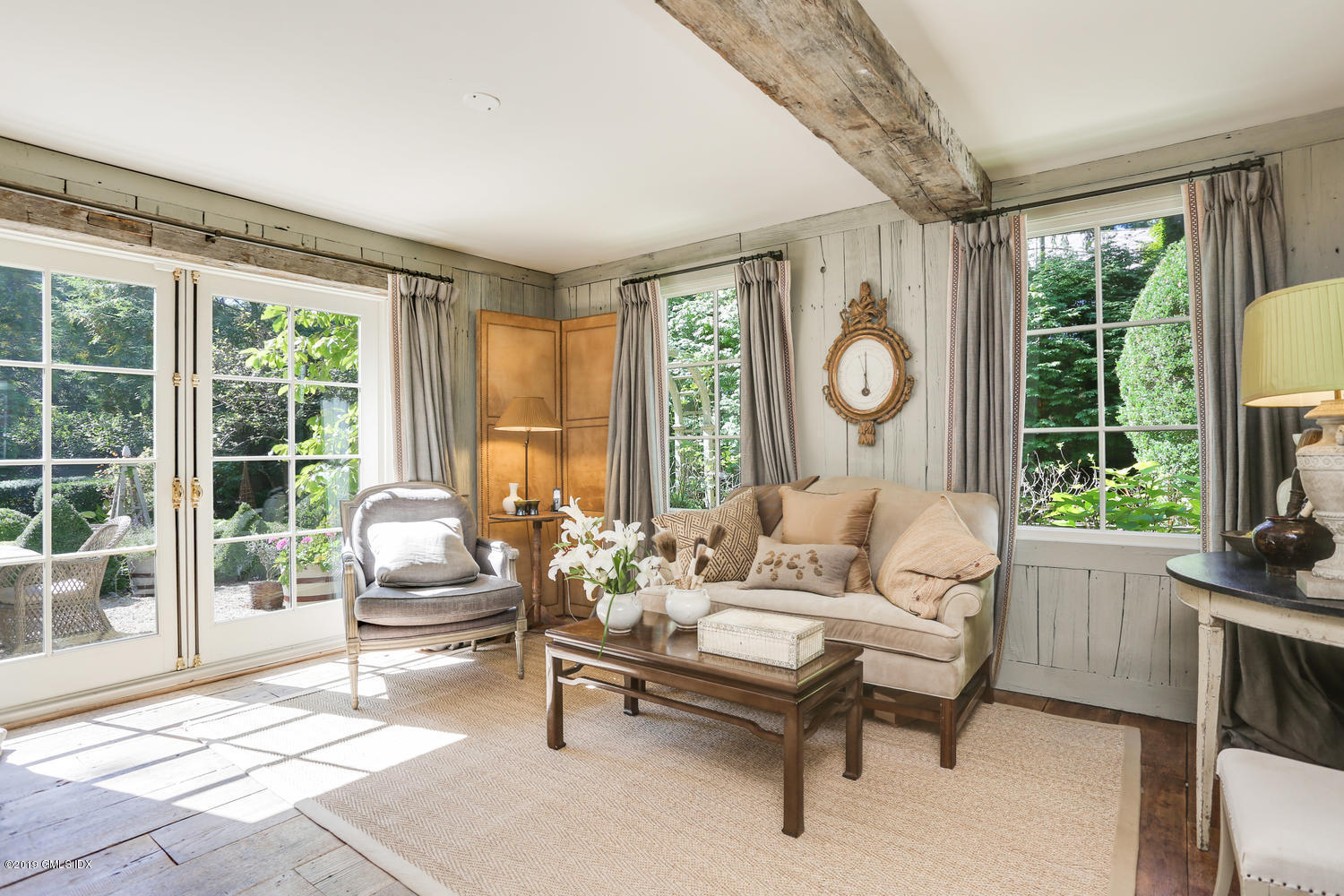 166 Old Church Road Greenwich, CT 06830 - Photo 8 of 20 a living room with furniture and a floor to ceiling window