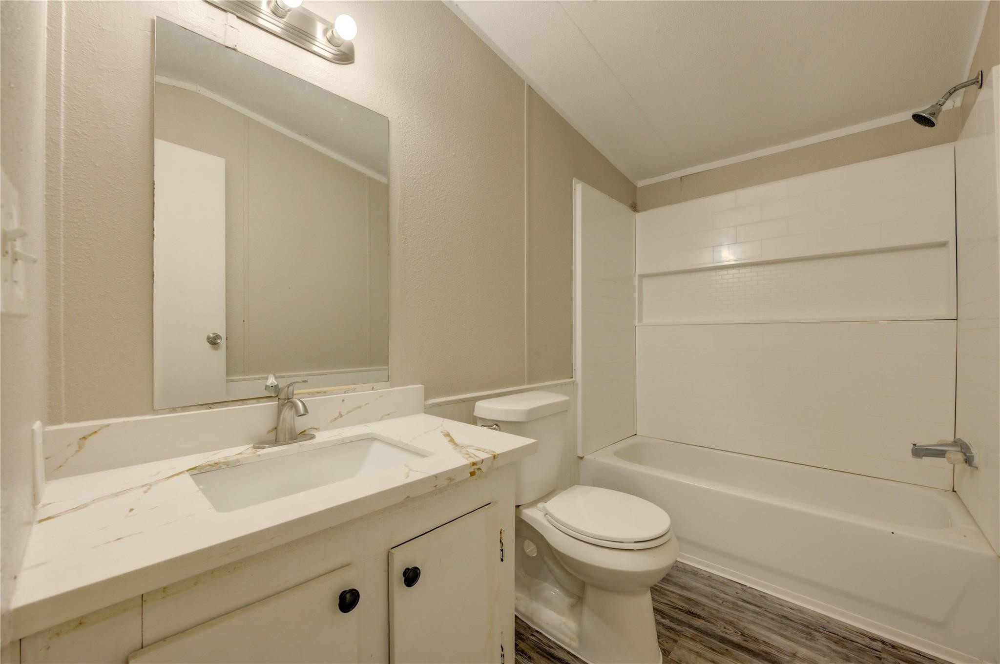 13265 Pecan Tree Drive Willis, TX 77318 - Photo 12 of 19 a bathroom with a sink a toilet and shower