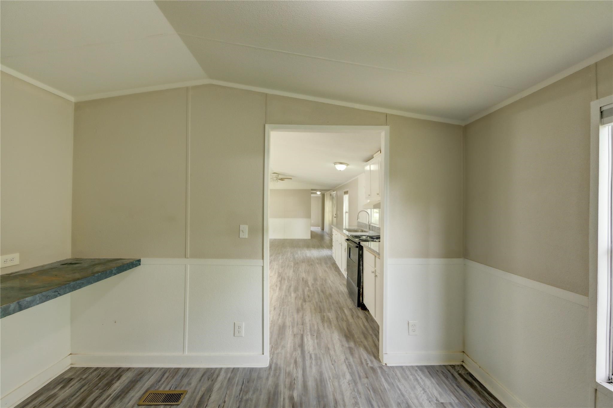 13265 Pecan Tree Drive Willis, TX 77318 - Photo 14 of 19 a view of empty room with wooden floor