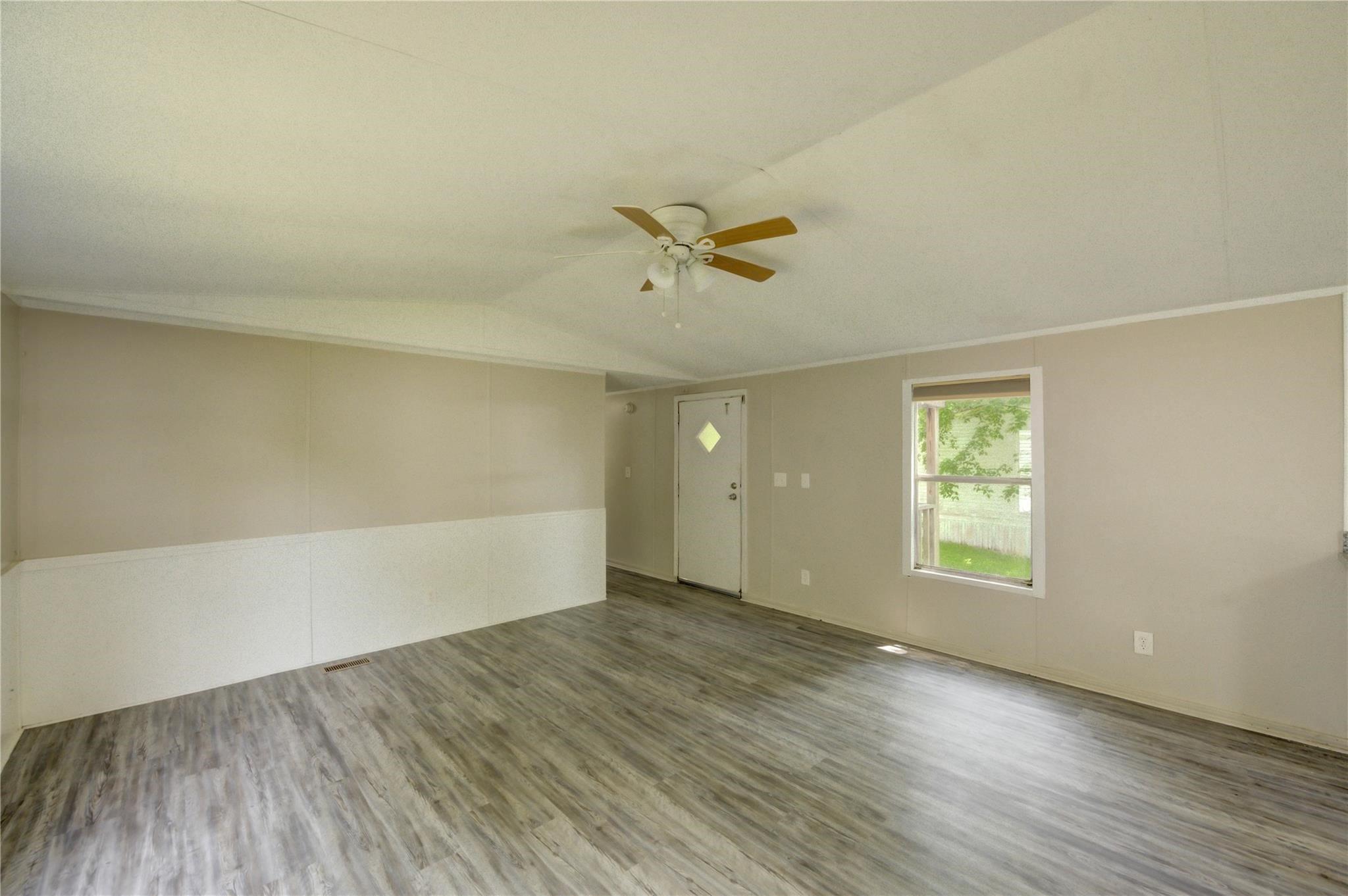 13265 Pecan Tree Drive Willis, TX 77318 - Photo 17 of 19 wooden floor in an empty room with a window