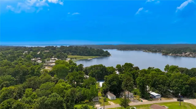 a view of a lake with houses in the back