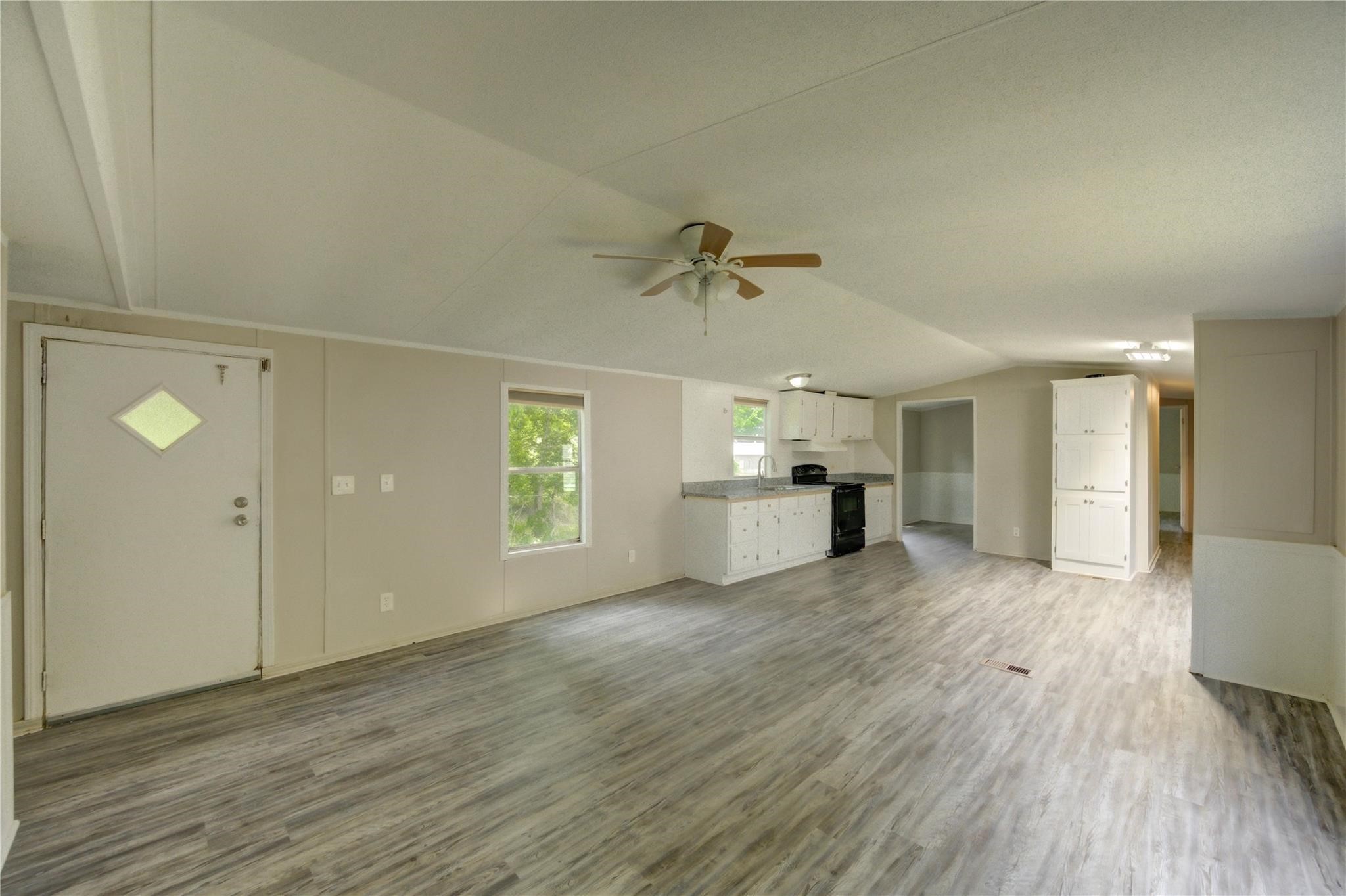13265 Pecan Tree Drive Willis, TX 77318 - Photo 6 of 19 a view of empty room with wooden floor and window