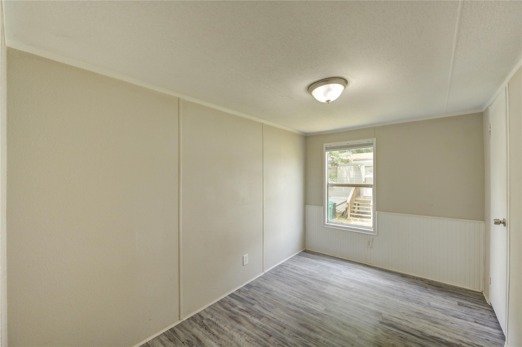 13265 Pecan Tree Drive Willis, TX 77318 - Photo 10 of 19 a view of an empty room with a window
