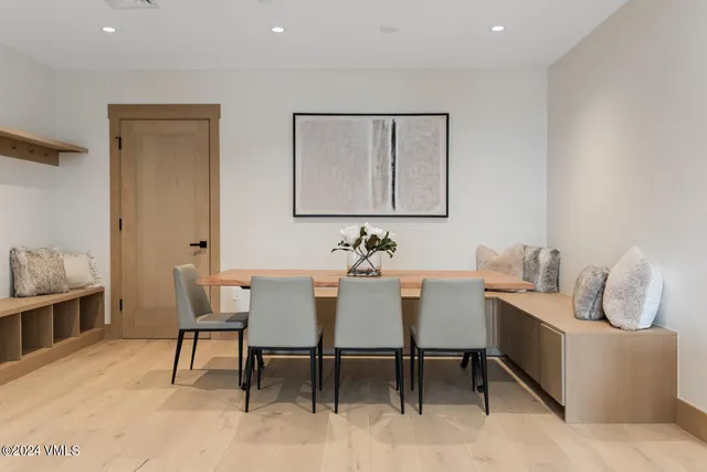 a dining room with furniture and window