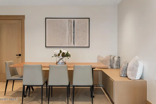 a dining room with furniture and window