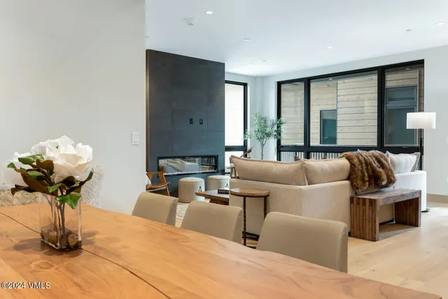 a living room with furniture and a large mirror