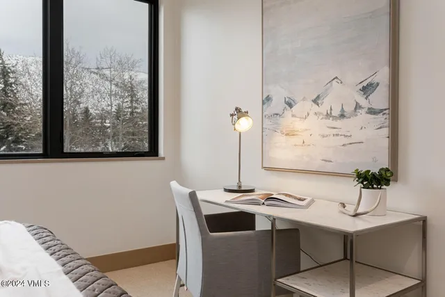 a view of a dining room with furniture and window