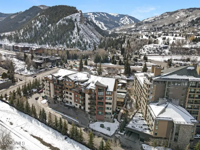 a view of a large building with a yard