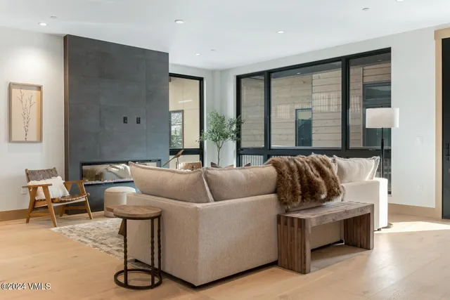 a living room with furniture and a large window