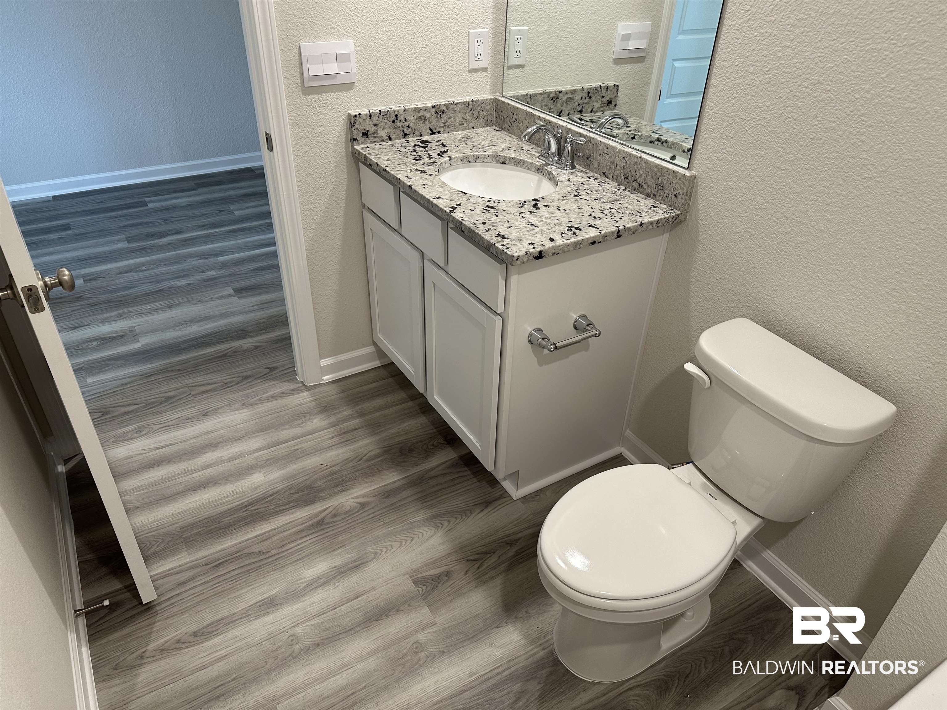 1238 Hayward Loop Foley, AL 36535 - Photo 14 of 46 Bathroom with hardwood / wood-style floors, vanity, and toilet