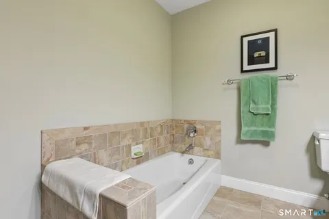 a bathroom with a bathtub and a sink